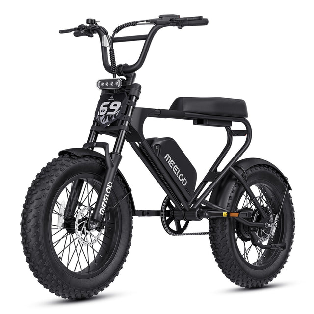 Moped-style electric bike with bench seat and fat tires